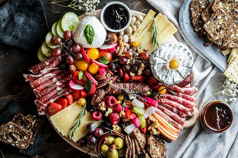 A beautifully arranged charcuterie board showcasing diverse appetizers.