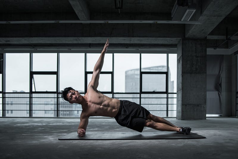 Side plank leg raise demonstration