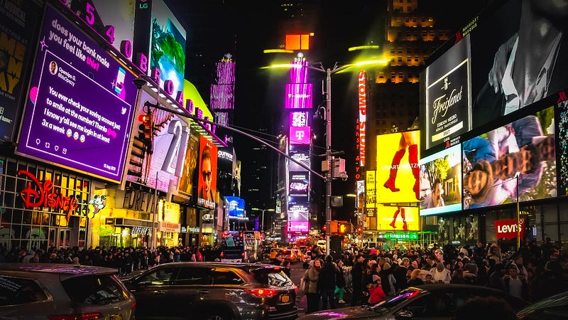 Nighttime view of Times Square with vivid lights