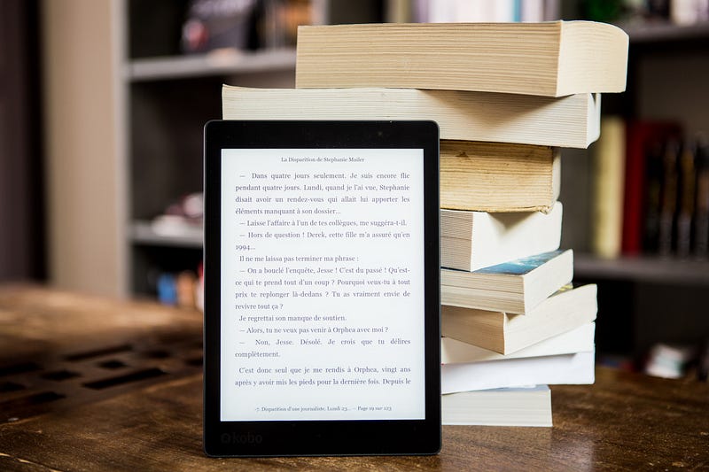 A collection of books on a cozy reading desk