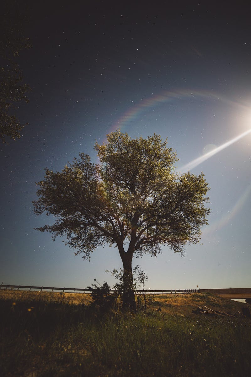 A beautiful moonbow across a night sky.