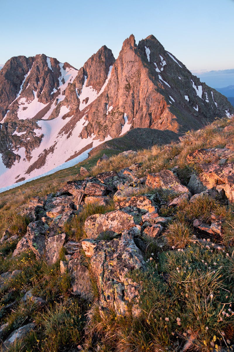 Glowing mountain peaks illuminated by magical light